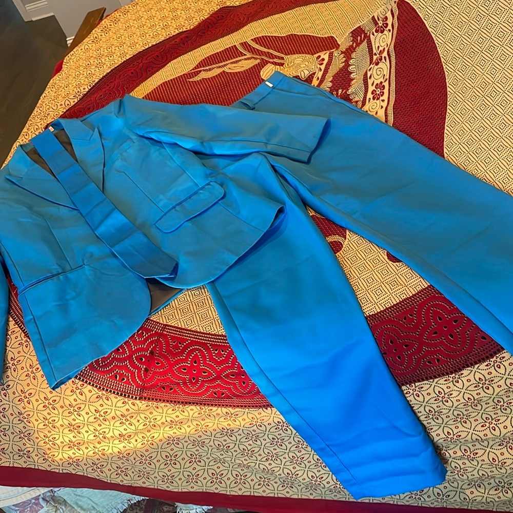 You Look Ugly Today blue pantsuit and tie